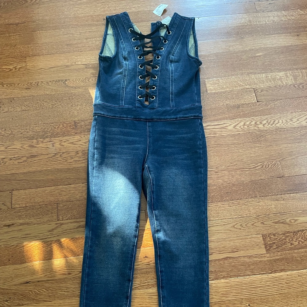Brand new never worn with tags denim stretch jumpsuit with front lace detail.